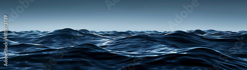 The image shows a rough sea with large, dark waves. The sky is cloudy and there is no land in sight. The image is taken from a low angle, making the waves look even more imposing.