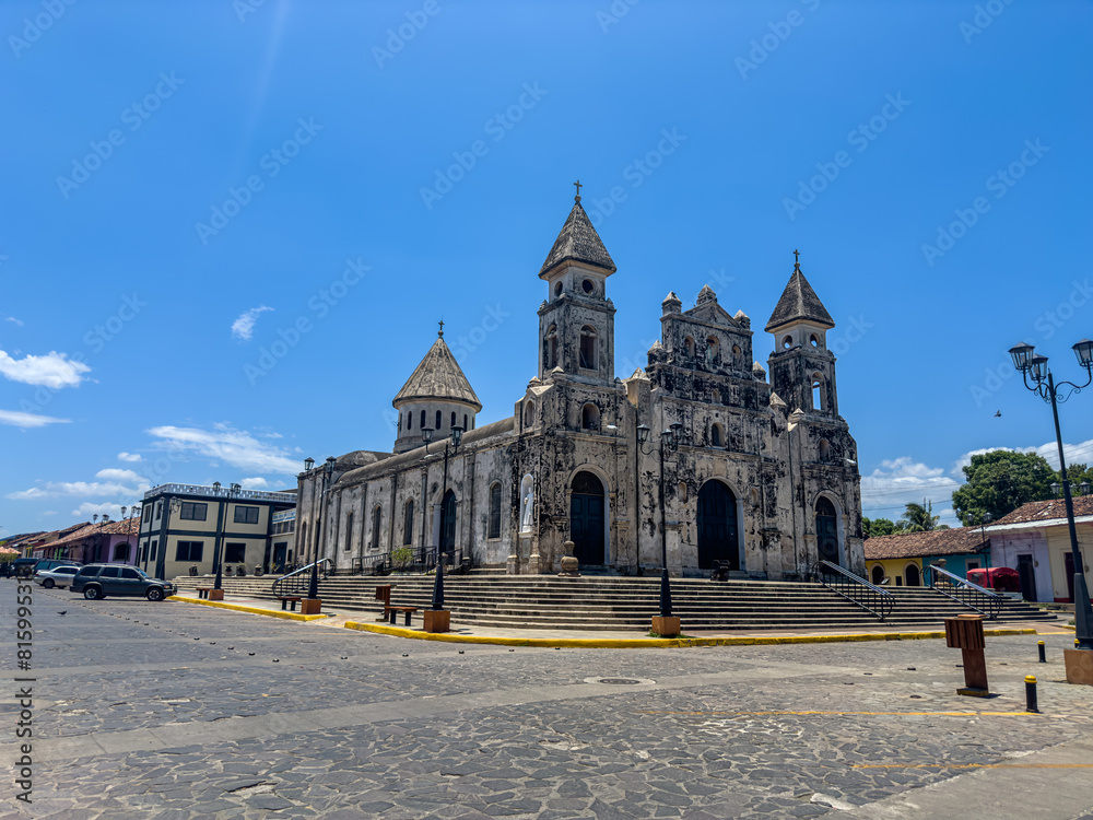 Fototapeta premium Beautiful view of the colonial city of Granada Nicaragua, Its majestic yellow cathedral, Guadalupe Church, the convent museum anda the calzada streets