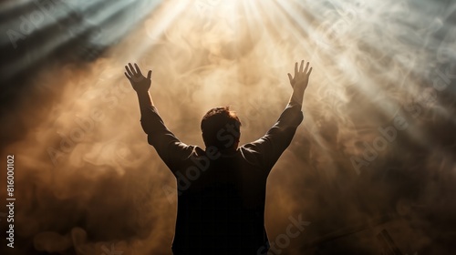 Man's Reverent Gesture Under Heavenly Glow