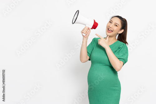 Portrait of Happy Asian pregnant woman holding megaphone isolated on white background, Speaker and announce concept