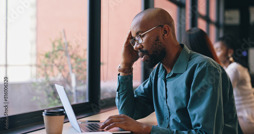 Business man, stress on laptop and cafe for remote work fail, mistake or news of bankruptcy. Tired African worker, freelancer or writer in pain, headache or fatigue typing on computer at coffee shop