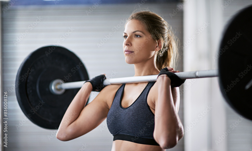 Woman, fitness and barbell lifting in gym, weightlifting and wellness for strength and power with bodybuilder. Exercise, challenge and training with athlete, muscle and health club or performance