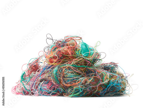 pile of tangled colorful sewing threads isolated white background