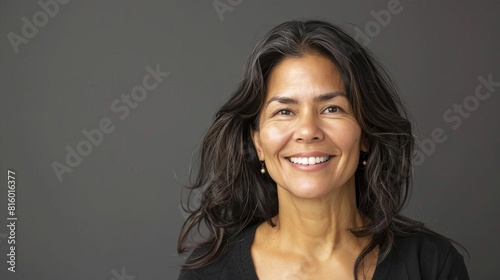 radiant confidence smiling hispanic woman exuding positive energy studio portrait