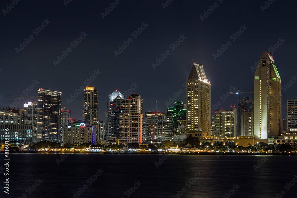 the iconic and breathtaking skyline of San Diego downtown at night. With a thousand lights on the big Towers the iconic and breathtaking skyline of San Diego downtown at night. With a thousand lights on the big Towers