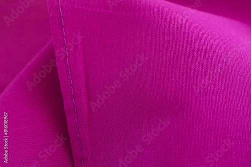 A close-up shot of a crimson cloth background