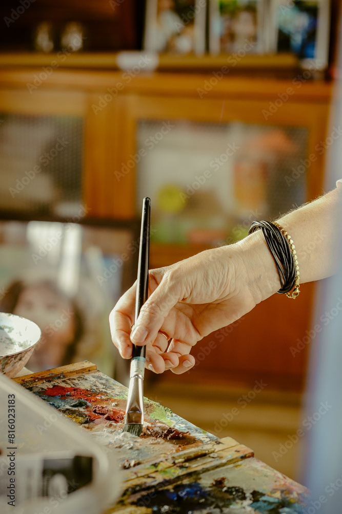 Cropped image of artist woman's hand drawing