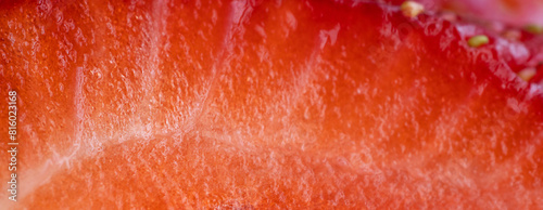 Strawberry texture. Strawberry in a close-up section. Macro photography. Summer background. Banner. © Наталья Зюбр