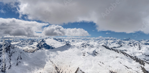 spring snow on mountain range over Bavona valley aerial, Switzerland photo