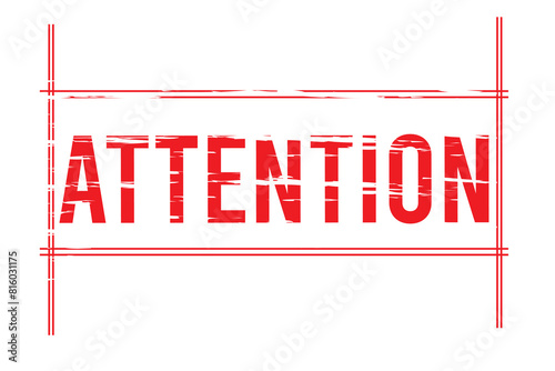 red stamp with the words attention