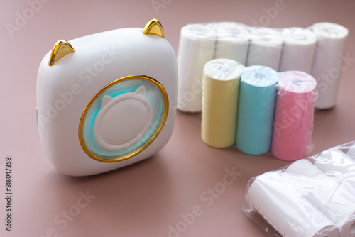 portable mini printer for office use. A toy for printing stickers and photos photo