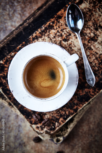 Cup of coffee on rustic wooden background. Top view.	