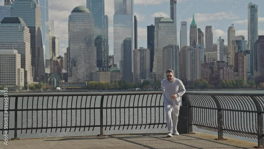 Running man in Manhattan. Copy space. Morning sport workout jogger run in New York. The jogger run at sport training. Sportsman jogger running. Man in sports suit training. Triathlete running Running man in Manhattan. Copy space. Morning sport workout jogger run in New York. The jogger run at sport training. Sportsman jogger running. Man in sports suit training. Triathlete running