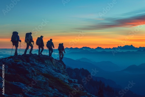 A silhouette of five hikers walking on the top of a mountain at dusk  with a blue sky and orange sunset in the background symbolizing adventure  exploration Generative AI