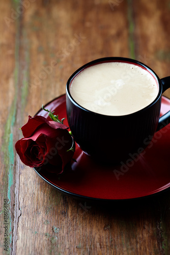 Cup of coffee on wooden background. Close up