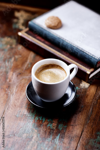 Cup of coffee on wooden background. Close up.
