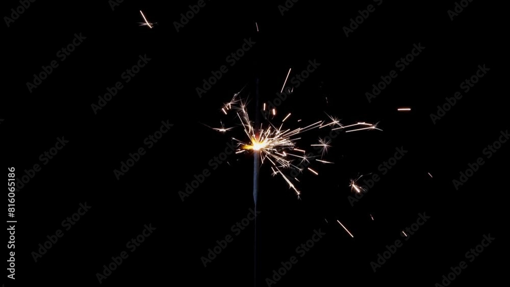 Lightening sparkler on the black background. Sparkler concept. Bengal lights are burning on a black background. Holiday party concept. New year party sparkler.