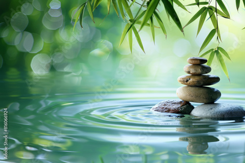 Ripples water with a few rocks pebble and green bamboo, spa concept serene background