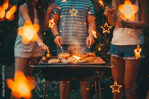 Backyard barbecue on the Fourth of July, with friends and family gathered around the grill, enjoying grilled favorites and cold drinks while sharing stories and laughter under the starlit sky photo