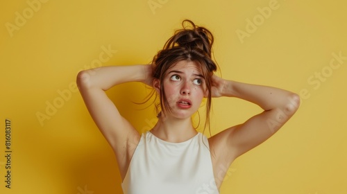 Frustrated Woman Against Yellow photo