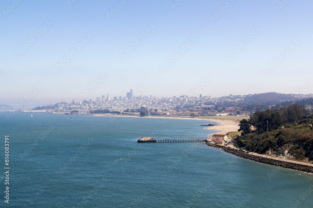 view from above over a small bay in front of the dusty morning city scape panorama of san francisco