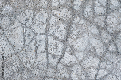 Gray cement surface with cracks