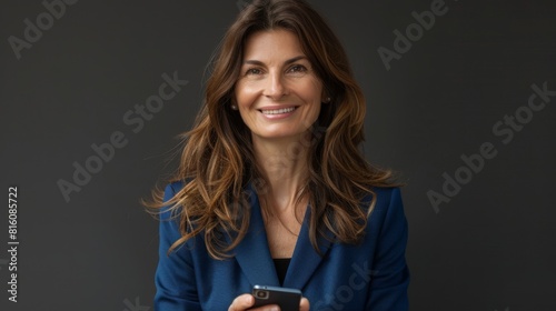 A Confident Businesswoman with Smartphone photo