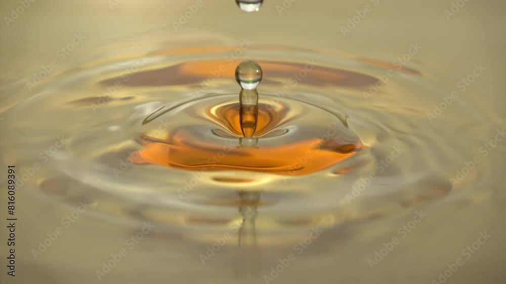 Cosmetics golden serum liquid. Falling drop macro abstract background. Cosmetic moisturizer essence gel. Collagen fluid bubble molecule. Yellow moisturizing cream oil. Beauty skin health care concept Cosmetics golden serum liquid. Falling drop macro abstract background. Cosmetic moisturizer essence gel. Collagen fluid bubble molecule. Yellow moisturizing cream oil. Beauty skin health care concept