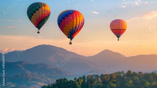 Colorful hot air balloons soar gracefully over the picturesque landscape of Doi Inthanon in Chiang Mai, Thailand. The vibrant balloons create a stunning contrast against the backdrop of the majestic © Rashid