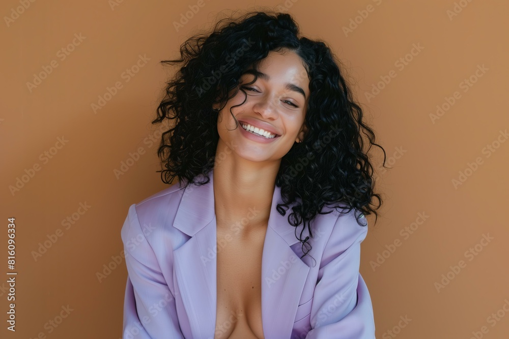 smiling woman with black hair wearing pastel purple summer suit, brown solid color background smiling woman with black hair wearing pastel purple summer suit, brown solid color background