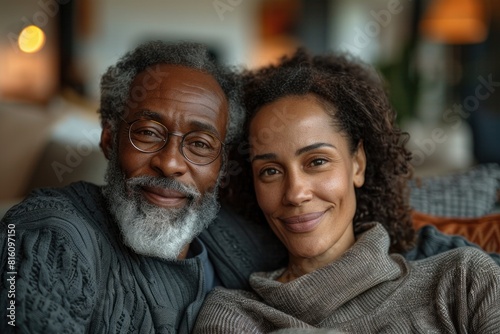 Elderly man and woman sharing a cozy moment at home, portraying a heartwarming generational connection with a blurred background adding to the comforting atmosphere