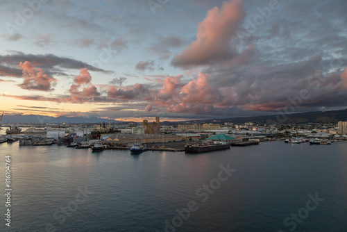 Amazing sunset exposure taking from a ship, of the Honolulu harbor in the downtown area, Honolulu, Hahu island, Hawaii.