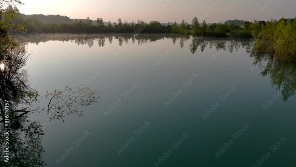 Drone Video Capturing a Misty Morning Over a Tranquil Lake Drone Video Capturing a Misty Morning Over a Tranquil Lake