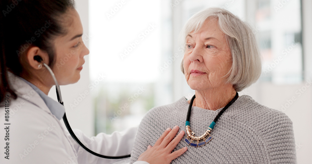 Fototapeta premium Woman, doctor and listening for patient heart beat in checkup, appointment or consultation at hospital. Medical healthcare expert examining elderly customer in cardiology with stethoscope at clinic