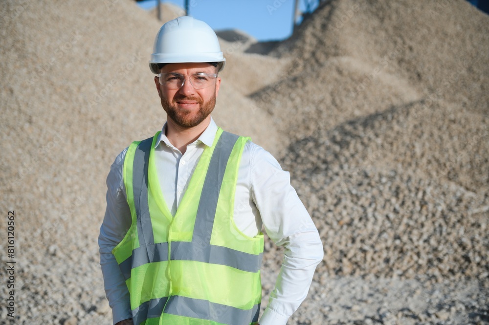 An engineer at a crushed stone or gravel plant. Stone mining