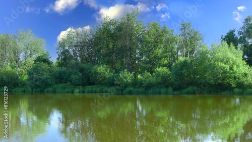 Landscape from a wooded river bank.