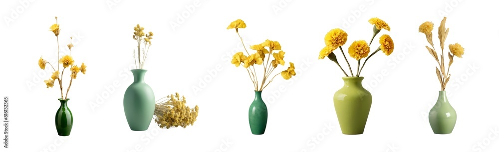 Dried yellow flowers for decoration placed in a green ceramic vase are seen against a plain Dried yellow flowers for decoration placed in a green ceramic vase are seen against a plain
