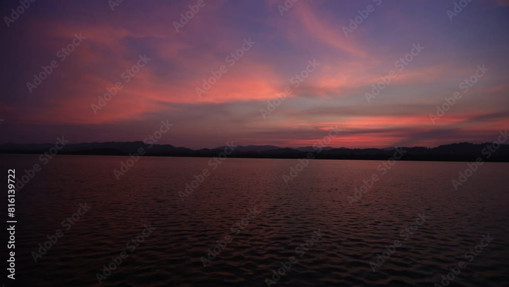High angle video background with mountain scenery The river and the beautiful sunshine blurred onto the water surface in a golden light, the beauty of nature during the trip. High angle video background with mountain scenery The river and the beautiful sunshine blurred onto the water surface in a golden light, the beauty of nature during the trip.