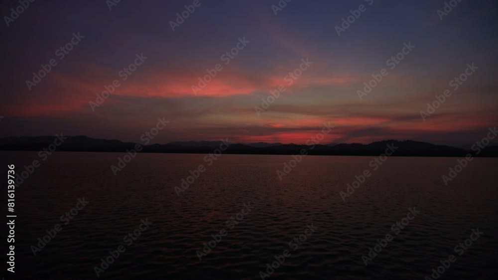High angle video background with mountain scenery The river and the beautiful sunshine blurred onto the water surface in a golden light, the beauty of nature during the trip. High angle video background with mountain scenery The river and the beautiful sunshine blurred onto the water surface in a golden light, the beauty of nature during the trip.