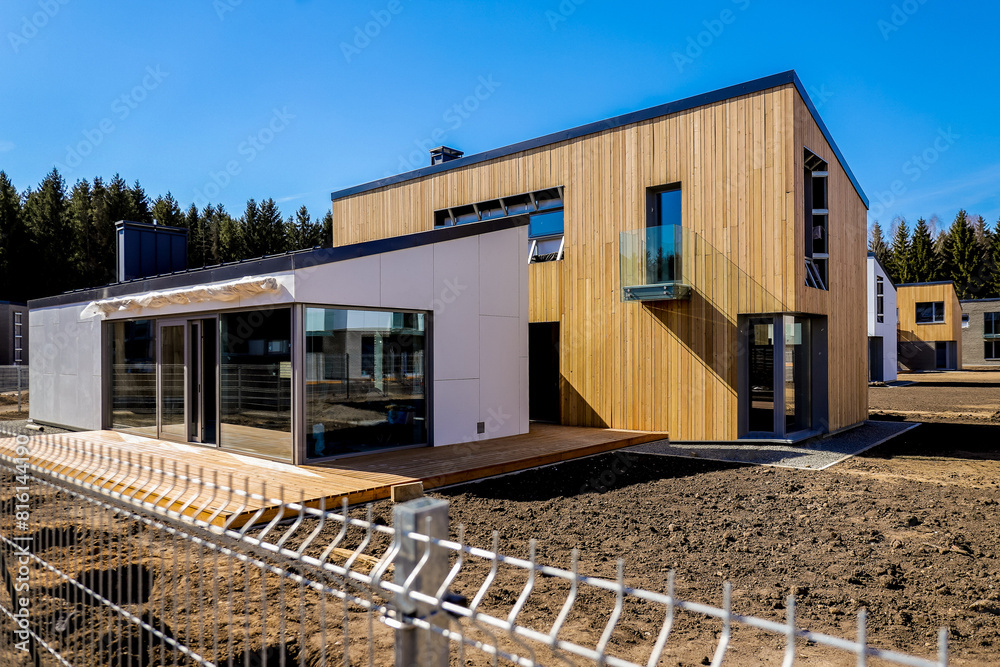Obraz premium Quaint Scandinavian Cottage nestled amidst lush greenery