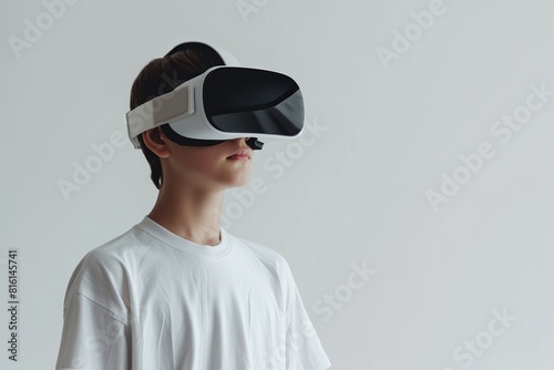 Young Boy Wearing VR Headset on White Background © Darya Pol