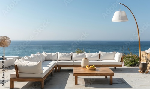 A wooden sofa with pillows on the terrace of a modern villa overlooking the sea