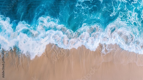 Aerial View of Beach With Waves Crashing on Sand photo