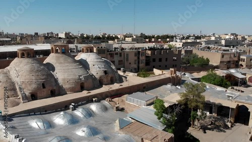 Aerial view of Qom city and witness the ancient mud structures and traditional historical bazaar with dome ceilings. photo