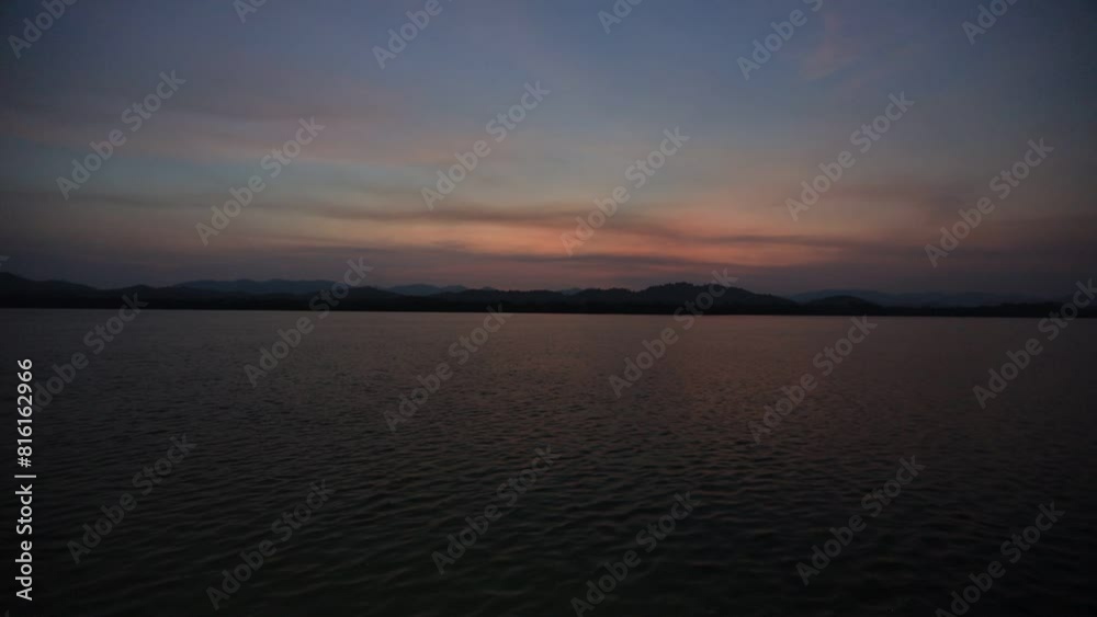 High angle video background with mountain scenery The river and the beautiful sunshine blurred onto the water surface in a golden light, the beauty of nature during the trip. High angle video background with mountain scenery The river and the beautiful sunshine blurred onto the water surface in a golden light, the beauty of nature during the trip.
