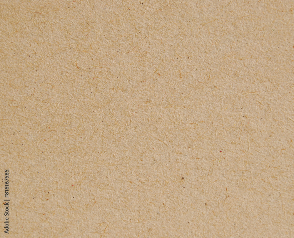 A sheet of brown recycled cardboard texture as background A sheet of brown recycled cardboard texture as background
