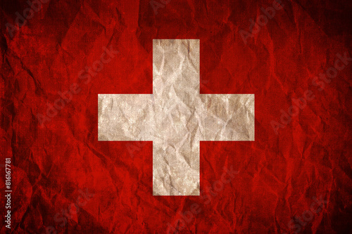 Flag of Switzerland on old grunge wrinkled surface background