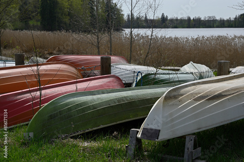 overturned boats on the lake shore