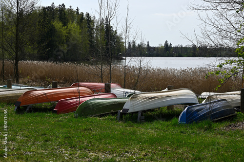 overturned boats on the lake shore