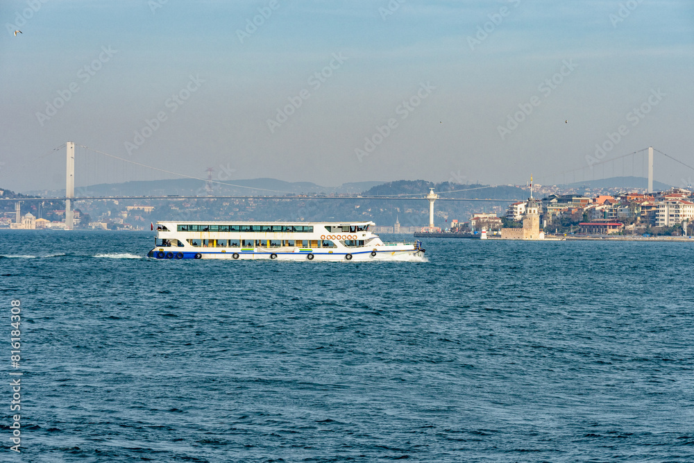 View of Bosphorus Bridge and boats in Istanbul, Turkey.